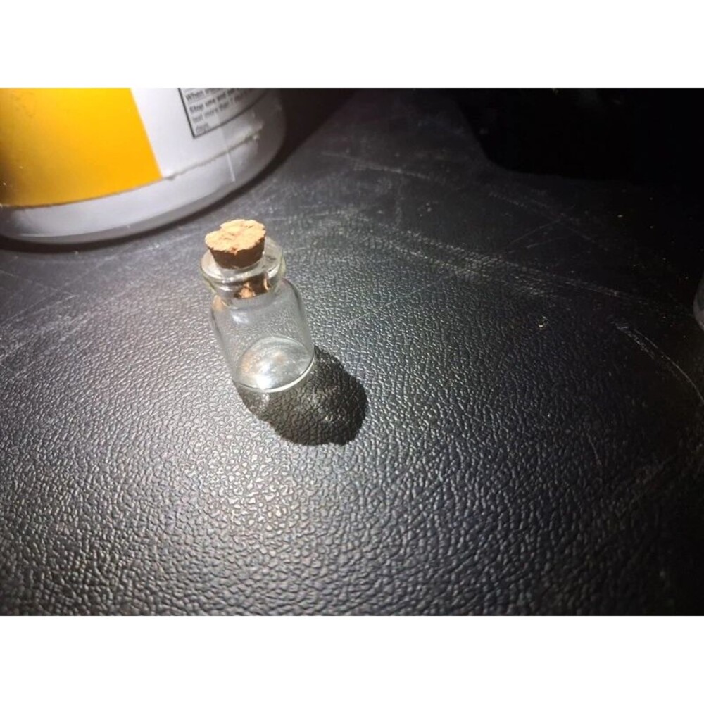 Itty bitty glass jar with cork
